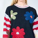 Playful floral applique sweater