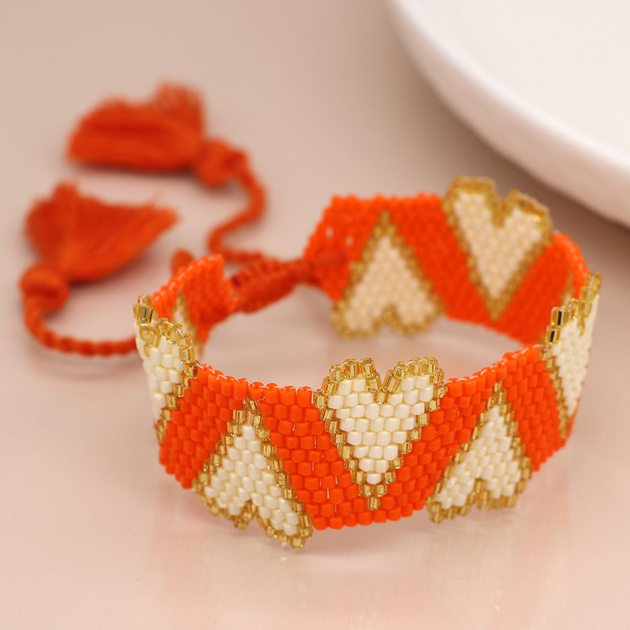 Orange bead and white hearts bracelet 3988