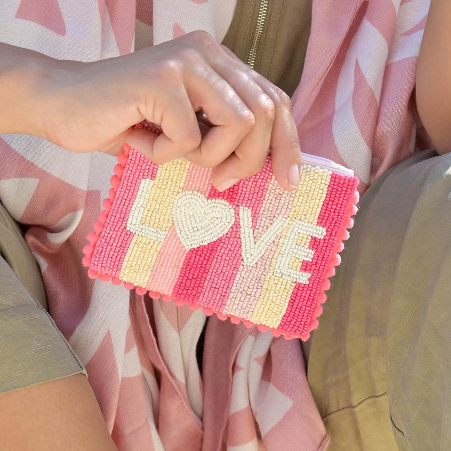 Small pink beaded love striped pom-pom purse