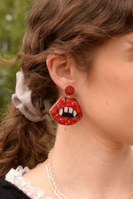 RED FANG LIP EARRINGS