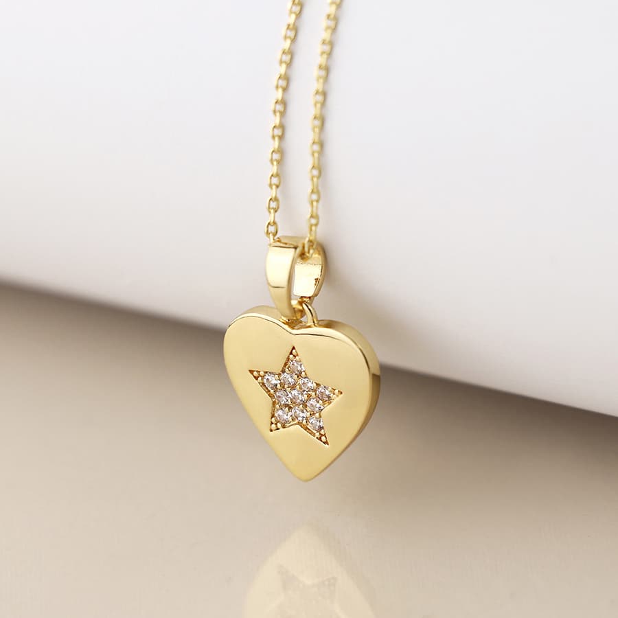 Golden heart necklace with pave crystal star