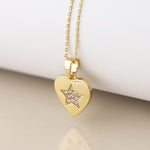 Golden heart necklace with pave crystal star