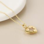 Golden heart necklace with pave crystal star