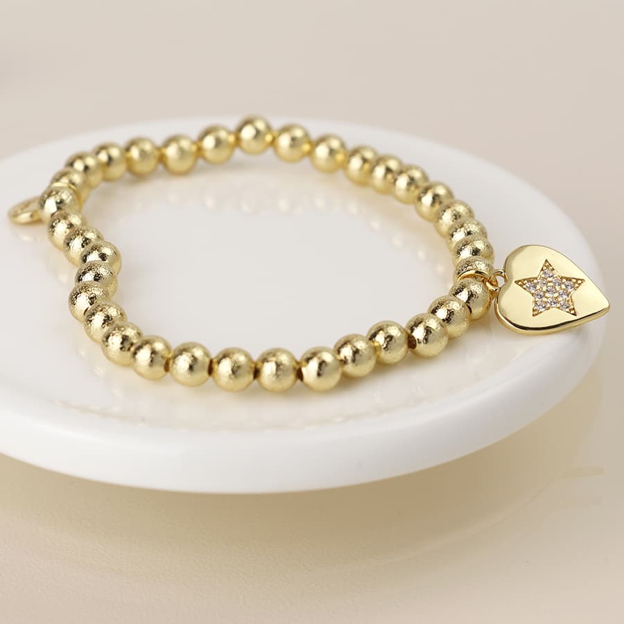 Golden beaded heart charm bracelet with pave crystal star