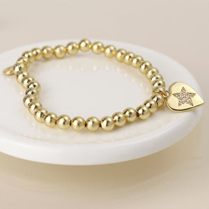 Golden beaded heart charm bracelet with pave crystal star