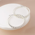Silver plated fancy twist hoop earrings