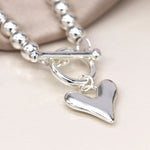 Silver plated bead and heart charm t-bar bracelet