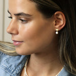 Golden brushed heart and pearl stud earrings
