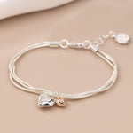 Triple chain bracelet with hearts