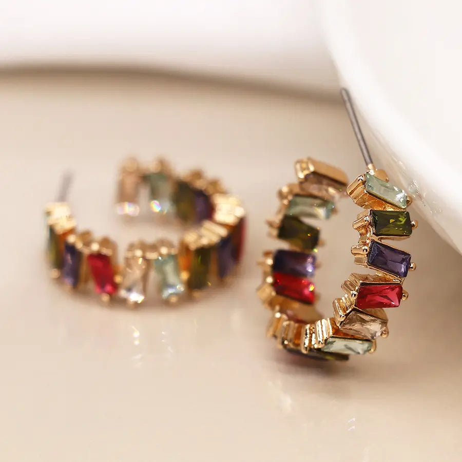 Golden staggered multicoloured crystal hoop earrings