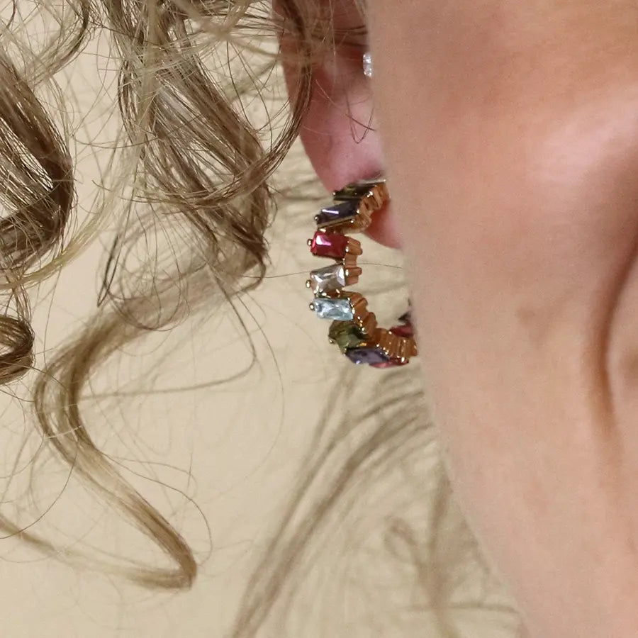 Golden staggered multicoloured crystal hoop earrings
