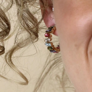 Golden staggered multicoloured crystal hoop earrings