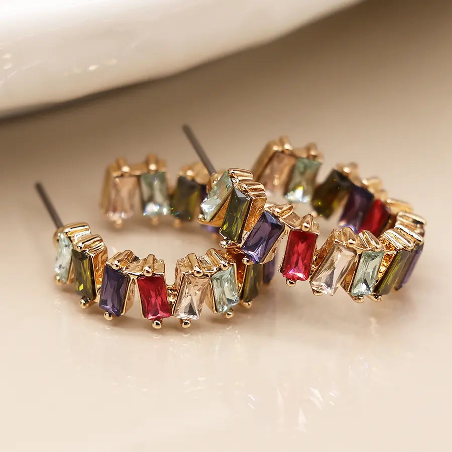 Golden staggered multicoloured crystal hoop earrings