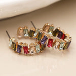 Golden staggered multicoloured crystal hoop earrings
