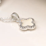 Silver plated crystal edged quatrefoil necklace