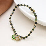 Green and golden bee charm bracelet
