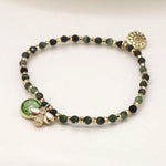 Green and golden bee charm bracelet