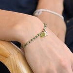 Green and golden bee charm bracelet