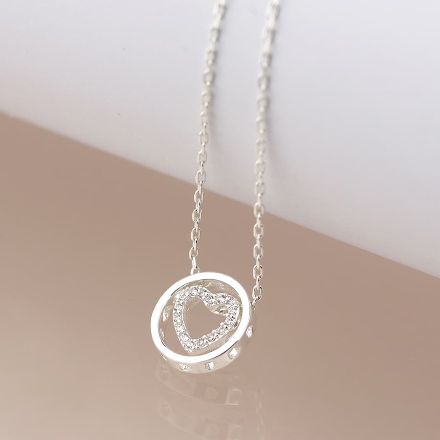 Silver plated crystal heart in circle necklace