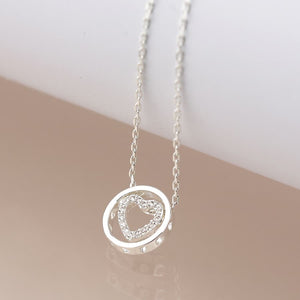 Silver plated crystal heart in circle necklace
