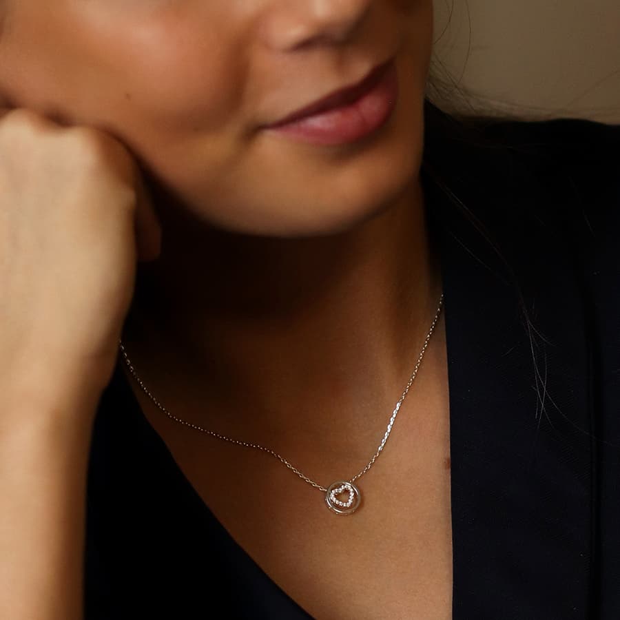 Silver plated crystal heart in circle necklace