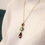Golden triple red, green and amber stone necklace