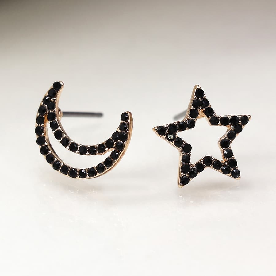 Faux gold mismatched star and crescent moon earrings with black crystals