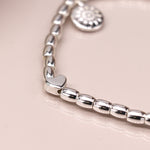 Puff heart bracelet with heart charm