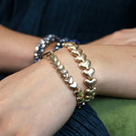 Golden worn hearts stretch bracelet
