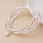 Silver plated bangle stack with ball charm