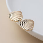 Golden clam shell stud earrings