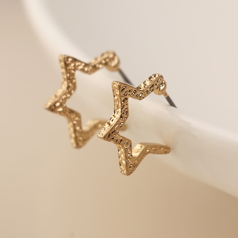 Golden textured star hoop earrings