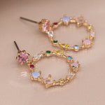 Golden decorative circle earrings with mixed crystals 4064