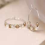 Silver plated wire hoop, stars and golden bead earrings