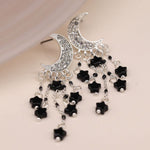 Silver plated crystal moon and black star earrings